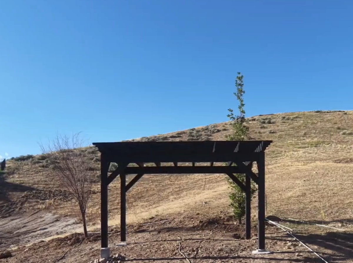 The Slate 12×16 pergola from farther down the hillside in Lehi, Utah